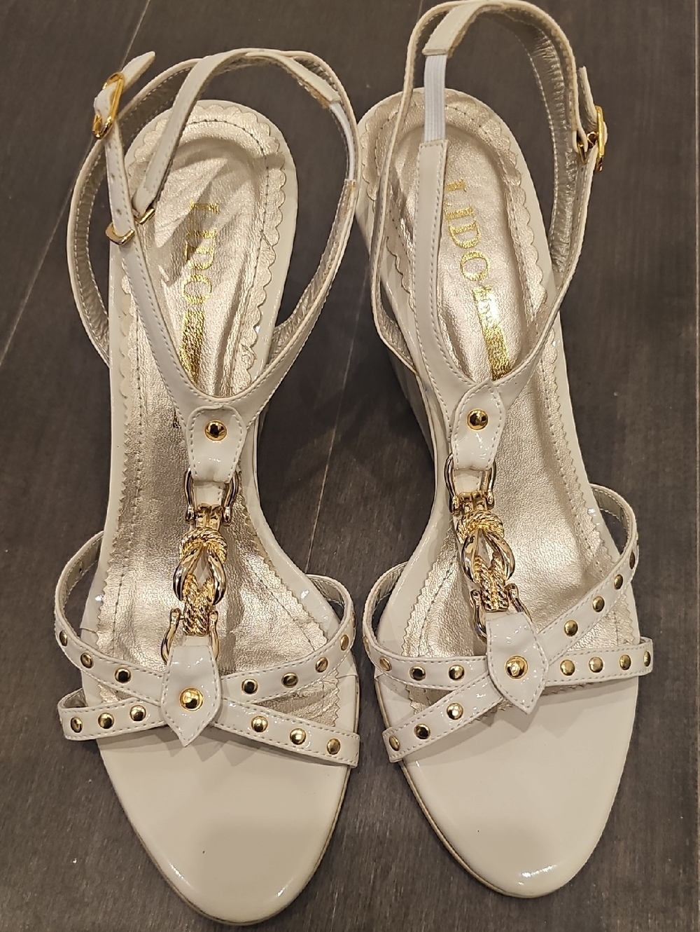 Mariam Nasser Zadeh Lido White Patent T-Strap Dress Sandals with Gold Accents